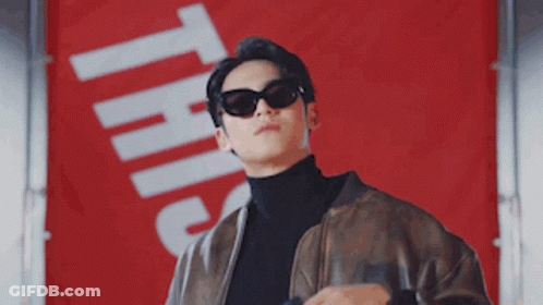 Man In Sunglasses Leather Jacket With Sign This GIF