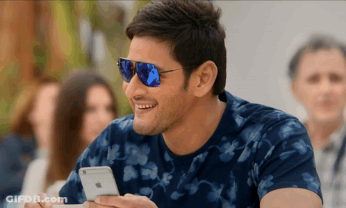 Man In Sunglasses Looking At Phone GIF