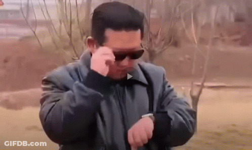 Man In Sunglasses Looking At Watch GIF
