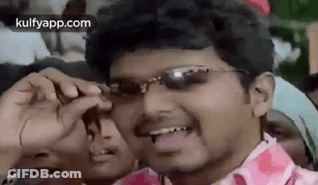 Man In Sunglasses Making Funny Face In Front Of Crowd GIF