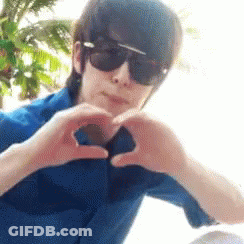 Man In Sunglasses Making Heart With Hands GIF