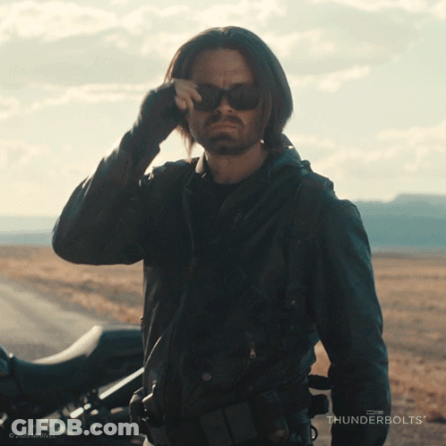 Man In Sunglasses Next To Motorcycle And Thunderbolts Logo GIF