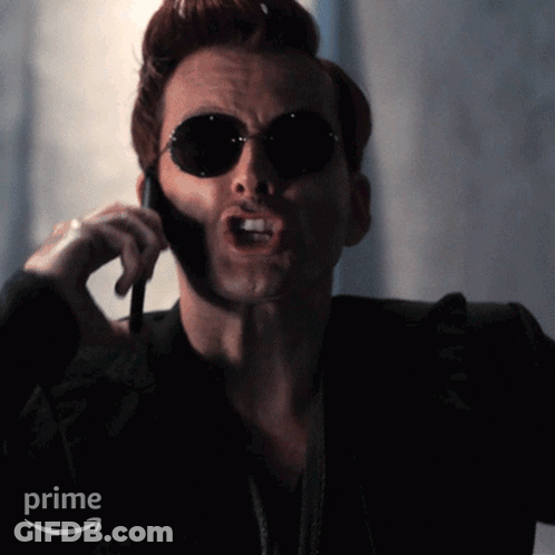 Man In Sunglasses On Cell Phone With Prime Logo GIF