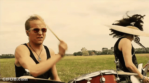 Man In Sunglasses Playing Drums With Woman GIF
