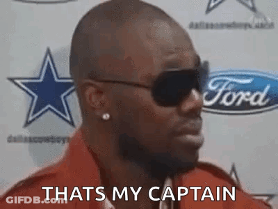 Man In Sunglasses, Red Shirt At Ford Sign GIF