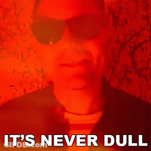 Man In Sunglasses Saying It's Never Dull GIF