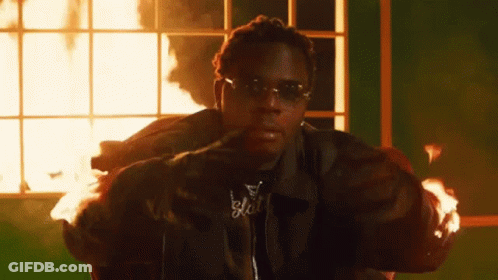 Man In Sunglasses Sitting Before Window Fire GIF
