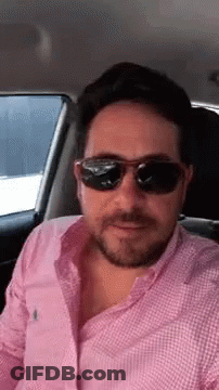Man In Sunglasses Sitting In Back Seat Of Car GIF