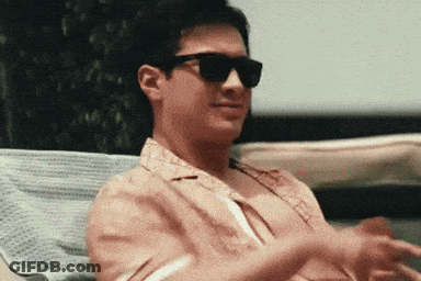 Man In Sunglasses Sitting On Chair GIF