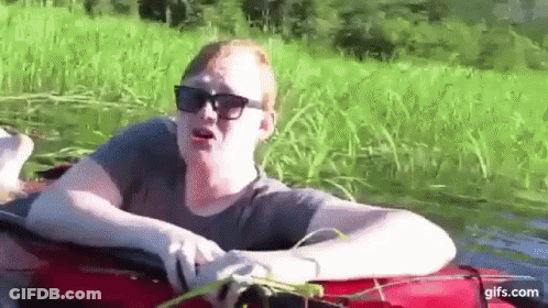 Man In Sunglasses Sitting On Red Raft GIF