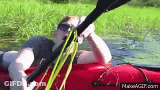 Man In Sunglasses Sitting On Red Raft GIF