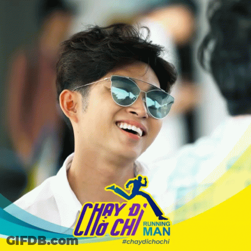 Man In Sunglasses Smiling In Front Of Running Man Ad GIF