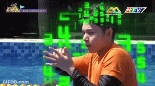 Man In Sunglasses Smiling In Front Of Running Man Ad GIF