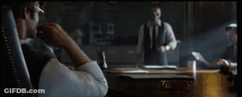 Man In Sunglasses Smoking Cigarette In Chair GIF