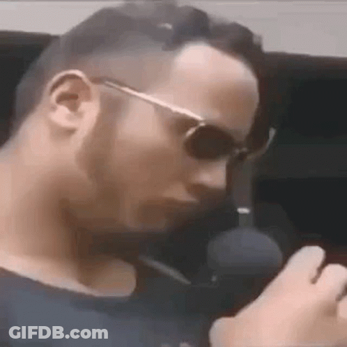 Man In Sunglasses Smoking Cigarette GIF