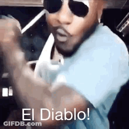 Man In Sunglasses Smoking Cigarette Saying El Diablo GIF