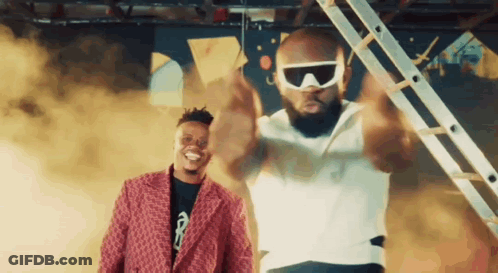 Man In Sunglasses Standing Next To Another Man GIF