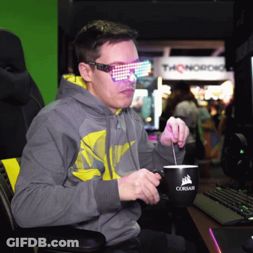Man In Sunglasses Stirring Coffee From Corsair Mug GIF