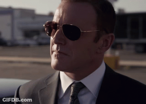 Man In Sunglasses, Suit, And Tie GIF