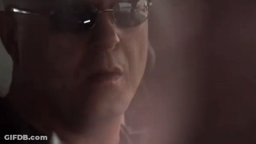 Man In Sunglasses Talking On Cellphone GIF