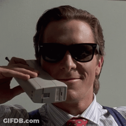 Man In Sunglasses Talking On Cellphone GIF