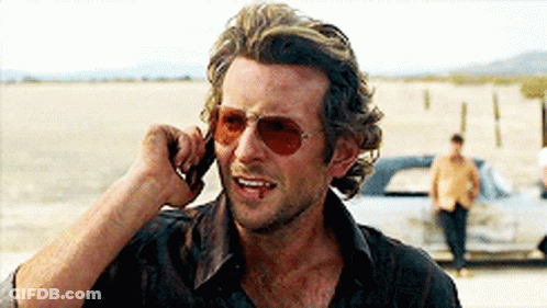 Man In Sunglasses Talking On Phone GIF