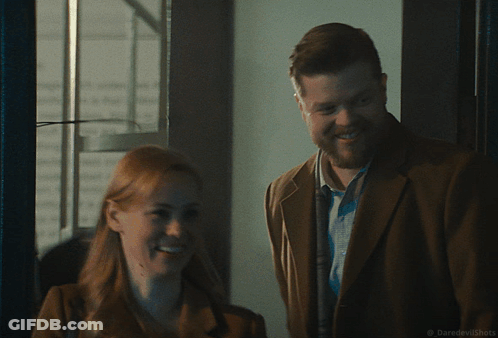 Man In Sunglasses Talking To Woman GIF