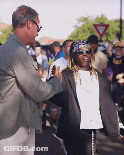 Man In Sunglasses Talks To Man In Bandana And LSU Shirt GIF
