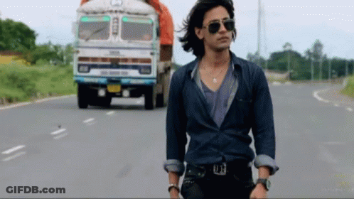 Man In Sunglasses Walking Past Tata Truck GIF