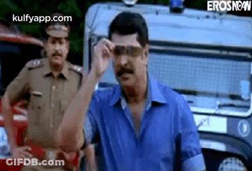 Man In Sunglasses With Police Car And Officer GIF