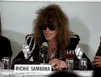 Man In Sunglasses With Richie Sambora Sign GIF