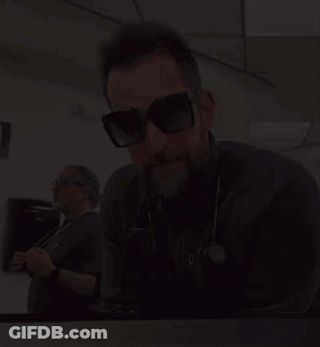Man In Sunglasses With Stethoscope Saying NC GIF