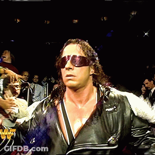 Man In Sunglasses With W Shirt In Front Of Crowd GIF
