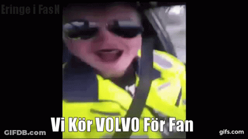 Man In Sunglasses Yellow Jacket Driving Says Vi Kör Volvo For Fan GIF