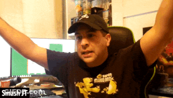 Man In Super Mario Bros Shirt Sitting At Computer GIF