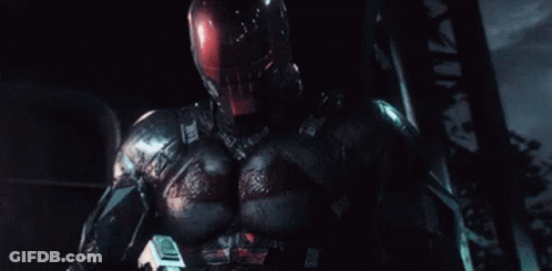 Man In Superhero Costum Attacked By Red Lasers GIF