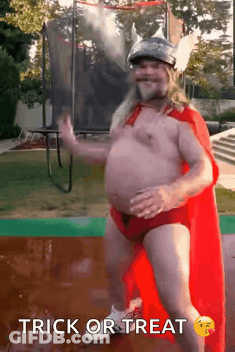 Man In Superhero Costume Dancing Trick Or Treat GIF