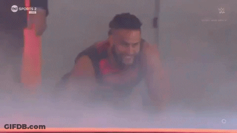 Man In Superhero Costume Flying Through Air GIF