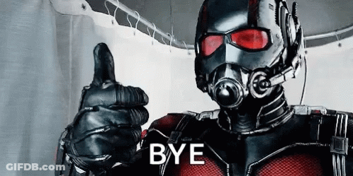 Man In Superhero Costume Giving Thumbs Up In Bathroom GIF