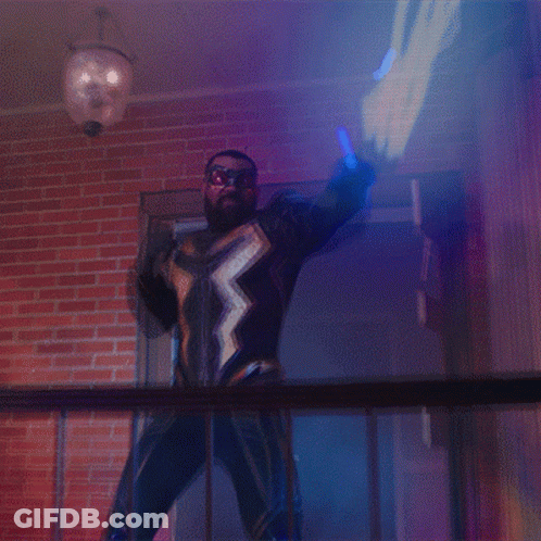 Man In Superhero Costume Holding Blue Light GIF