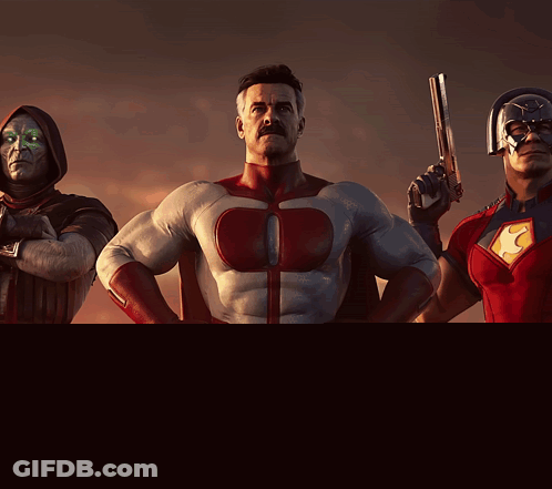 Man In Superhero Costume Holding Gun GIF