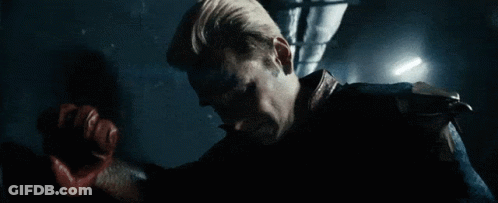 Man In Superhero Costume Holding Sword GIF