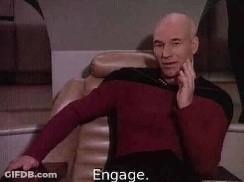 Man In Superhero Costume In Front Of Hamilton Ad GIF