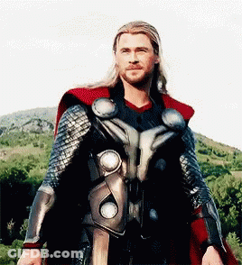 Man In Superhero Costume In Front Of Mountain GIF