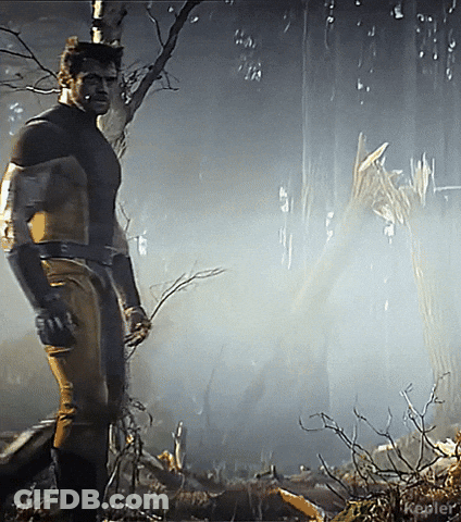 Man In Superhero Costume In Woods GIF