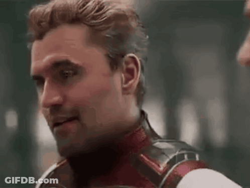 Man In Superhero Costume Looking At Another Man GIF