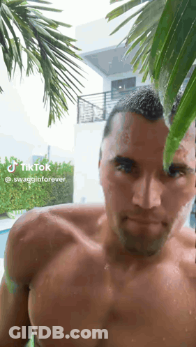 Man In Superhero Costume Making Face GIF