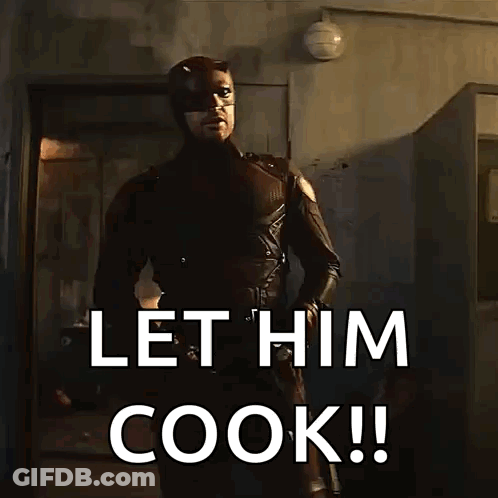 Man In Superhero Costume Saying Let Him Cook GIF