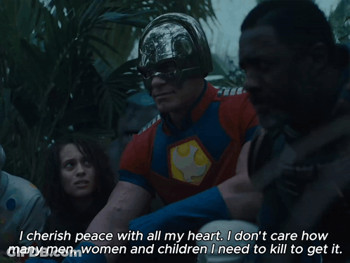 Man In Superhero Costume Talking To Group GIF
