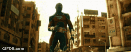 Man In Superhero Costume Walking GIF